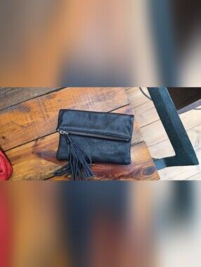 Roots Black Tassel Zip Clutch